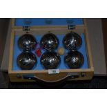 A cased set of six traditional French boules