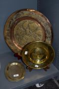 A 20th century copper charger, having pierced floral decoration, sold with a brass dish with