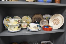 A selection of vintage and modern Poole Pottery, including hand painted cups, saucers and plates
