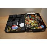 A hardshell case containing miscellaneous costume jewellery