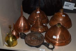 An attractive 19th/20th century copper wine funnel, smaller copper funnel, bcopper possser heads,