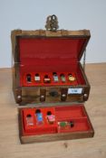A 20th Century novelty trinket box, in the form of a treasure chest, containing scent bottles