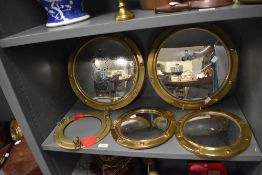 Two pairs of vintage porthole style convex mirrors, the largest having a diameter of 36cm, & a