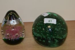 A Victorian glass dump weight, having controlled bubbles to centre.