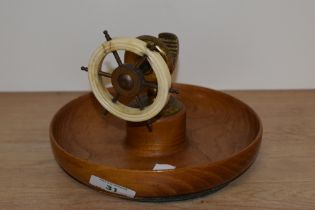 A mid century ships wheel nut cracker, mounted over turned elm or similar wood bowl.