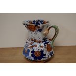 A large Masons Ironstone jug, having serpent handle and blue and rust foliate decoration.