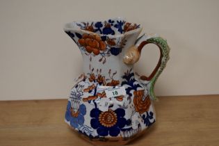 A large Masons Ironstone jug, having serpent handle and blue and rust foliate decoration.