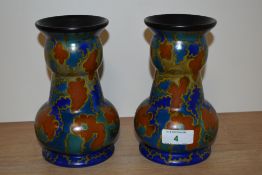 Two mid 20th century vases of unusual knopped form, in blue, yellow and rust colourway, marked