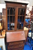 An Edwardian mahogany bureau bookcase of small proportions
