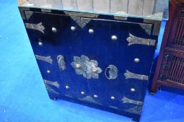 An Oriental side cabinet with reinforced corner and metal clasps etc