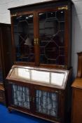 A 19th Century mahogany bureau bookcase having astral glazed top and bottom sections, with pictorial