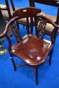 An Oriental hardwood corner chair