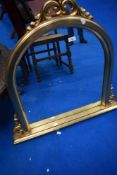 A modern gilt frame over mantel mirror of small proportions