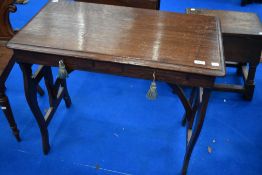 A late Victorian Arts and Crafts style oak side table with two frieze drawers