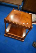 A reproduction yew wood occasional table with drawer to base