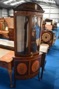 An Edwardian mahogany and inlaid full height corner dsiplay with cupboard under