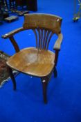 A late 19th or early 20th Century oak office chair, possibly Railways