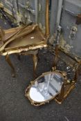 A gilt brass wall mirror and nest of vintage Italian tables