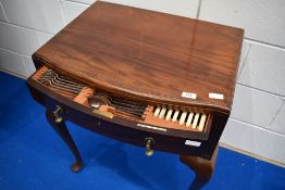 An early 20th Century cased canteen of cutlery , two drawers on cabriole legs