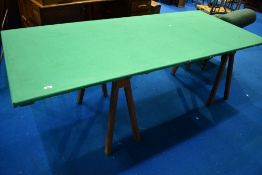 A traditional trestle table having felt covered top , approx. 216 x 94cm