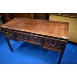 An Oriental hardwood desk, width approx. 123cm
