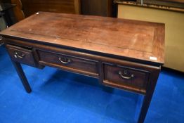 An Oriental hardwood desk, width approx. 123cm