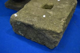 A large antique sandstone weight block