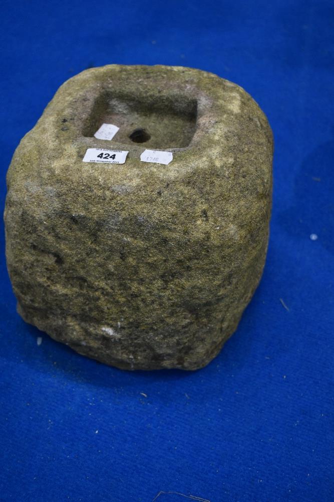 A small antique sandstone weight block