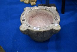 A stone mortar, suitable for garden