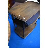 A dark stained Ercol tea trolley