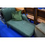 A Victorian chaise longue having later green upholstery