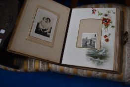 A Victorian photo album, with some photos