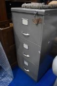 A vintage three drawer filing cabinet