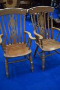 A pair of traditional beech kitchen carver chairs