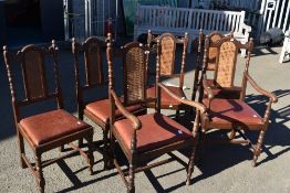 A set of six (four plus two carvers) early 20th Century oak dining chairs having part canework and