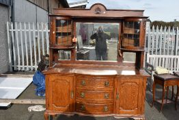 A late Victorian oak mirror back sideboard , with Art Nouveau style brass handles