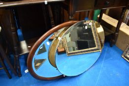 Two oval wall mirrors
