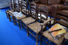 Seven (six plus one) rush seated ladder back chairs