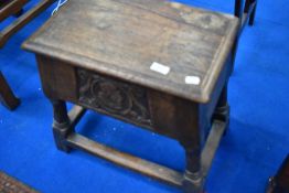 A traditional oak sewing stool