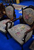 A pair of late Victorian salon armchairs having tapestry upholstery