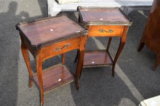 A pair of reproduction mahogany galleried side tables