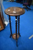 A late 19th or early 20th Century plant stand having twist frame