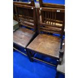 A pair of Georgian mahogany solid seat dining chairs