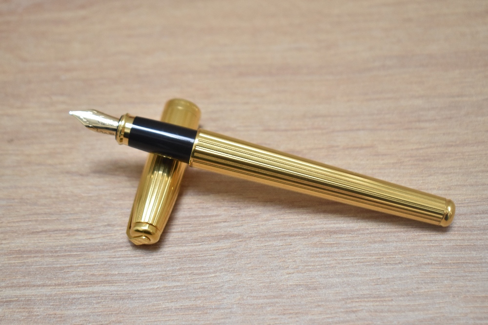 A boxed S T Dupont Fidelio gold plated cartridge fountain pen having 14k Dupont nib - Image 2 of 4