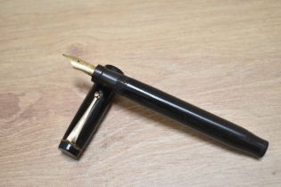 A Parker Duofold Lucky Curve Snr button fill fountain pen in black with two narrow bands to the