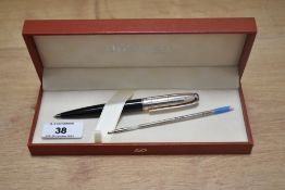 A boxed S T Dupont ballpoint pen in black body and silver top