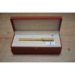 A boxed S T Dupont Montparnasse converter fountain pen gold plated reeded design having 18k Dupont