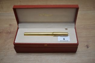 A boxed S T Dupont Montparnasse converter fountain pen gold plated reeded design having 18k Dupont