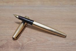 A Parker 65 Insignia converter fountain pen in rolled gold (double jewelled) having Parker 14K