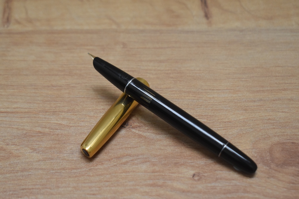 AnAurora 88P piston fill fountain pen in black with gold cap